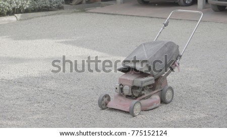 Mower placed on the sand.