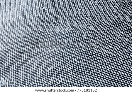 fabric, background texture. White silver mesh fabric, with a woven metallic thread. Silver fashion mesh! Flickering beads add texture and shine to the piece.