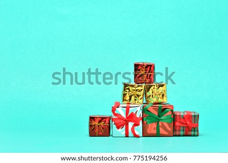Collection of Christmas or new year gift boxes on a light green background