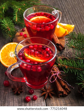 Christmas hot mulled wine with cranberries on a table