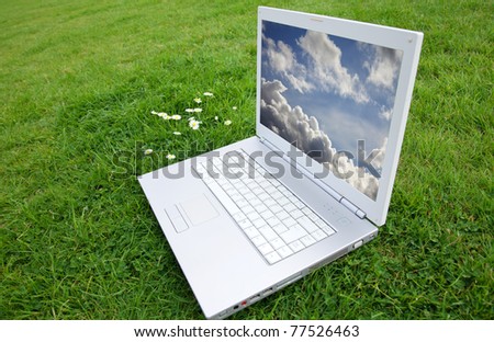 New white laptop in park