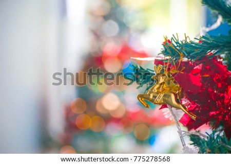 Christmas tree with leaf christmas and gift box on tree bokeh background. Using wallpaper or background for happy new year 2018 image.