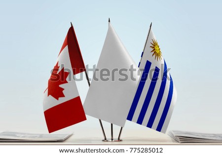 Flags of Canada and Uruguay with a white flag in the middle