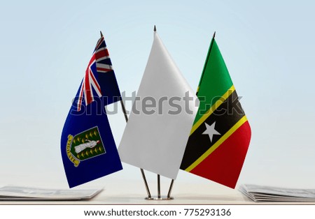 Flags of British Virgin Islands and Saint Kitts and Nevis with a white flag in the middle