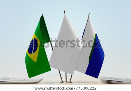 Flags of Brazil and Navassa Island with a white flag in the middle