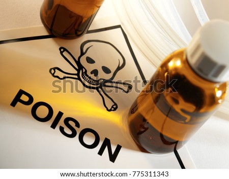 Poison bottles with Poison symbol and Skull and Crossbones. Royalty-Free Stock Photo #775311343