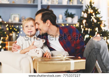 New Year's image of son and father with gift