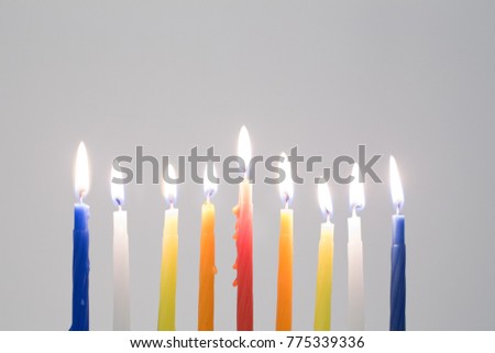 Colorful Hanukkah candles lights and flames