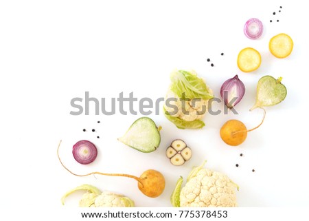 Vegetables isolated on white background top view. Creative composition of fresh vegetables (cauliflower, garlic, turnip, radish, red onion), flat layout. Abstract food background.