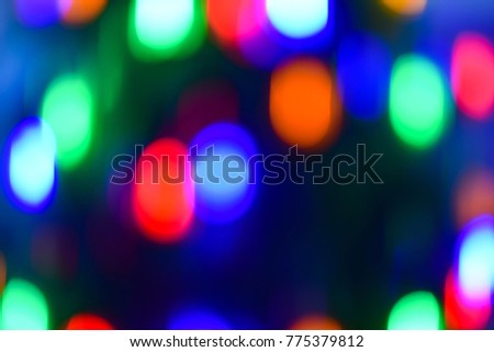 Christmas and new year decoration (background). Abstract blurred bokeh blinking garland.