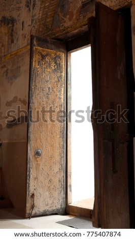 Old golden wooden door in Thailand and Sunlight in winter