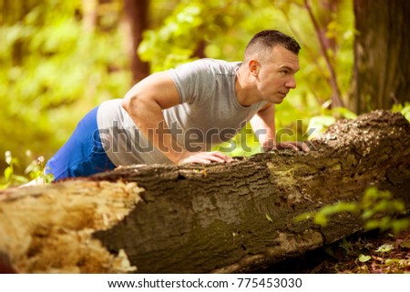 Athletic young man in the nature. Healthy lifestyle