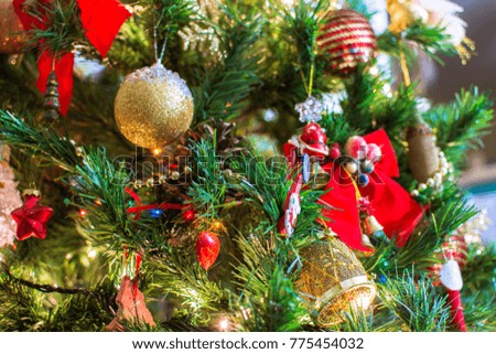 Jingle bell, Christmas tree branches with blurred background.
