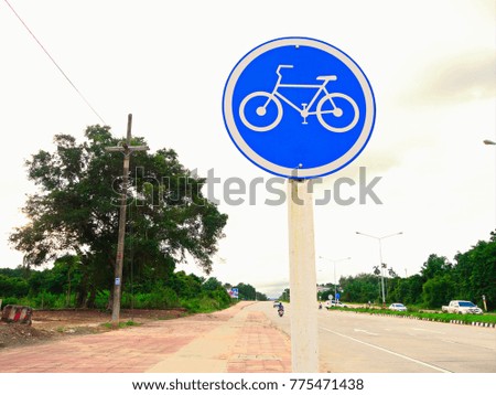 Bicycle sign on footpath.