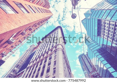 Looking up in New York City, color toned picture, USA.