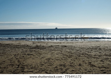 beautiful wave from the sea and white sand in autumn with ship at bournemouth