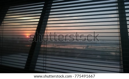 blurry picture: sunset sky, looked from inside the building 