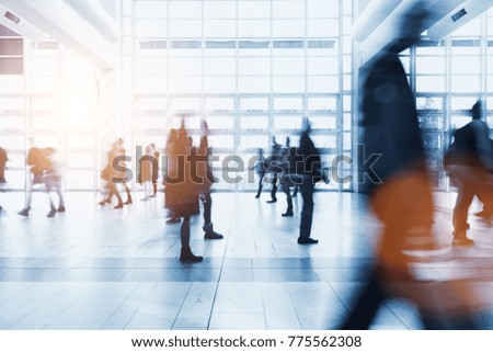 crowd of Blurred people rushing at a business center