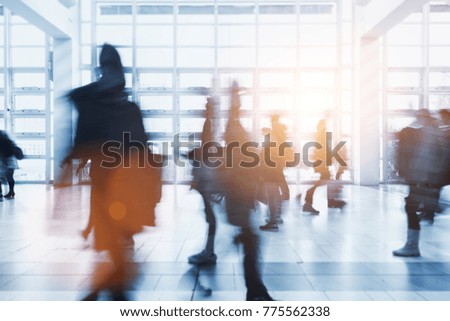 crowd of Blurred people walking in a airport