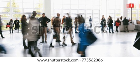 Blurred people in a modern environment on a trade show