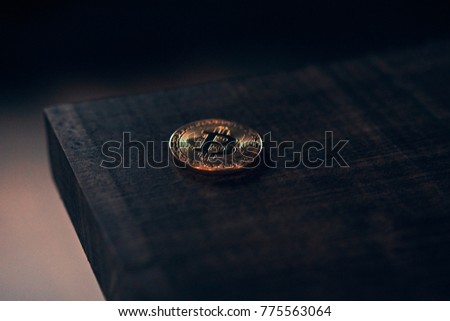 ?oin bitcoin on a wooden table. Golden ?ryptocurrency. Blockchain
