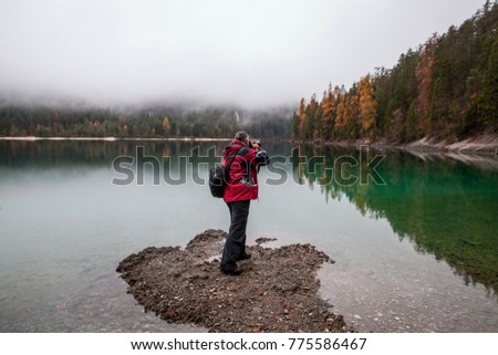 photographer shooting lake