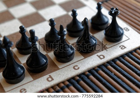 Magnetic Wooden Chess Board and steel chess pieces, isolated on board