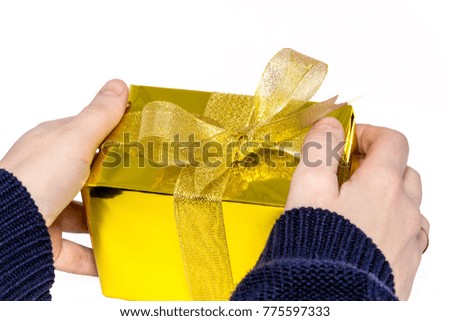 Hand woman holding gift box on isolated with clipping path. Image of christmas gift with hands isolated white.