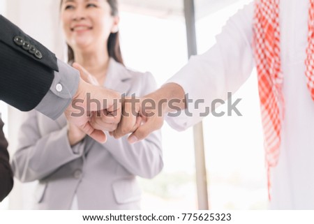 Businessmen confidently holding hands after successful meetings.He is making an agreement with his partner,Close-up of two businesspeople shaking hands while at work.