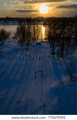 sunrise in winter over city. natural environmental detail view in latvia