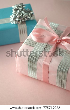 Elegant gift-wrapped box in pretty paper and bow with copy space