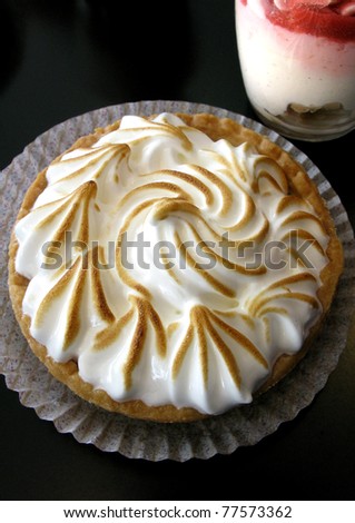 Lemon meringue pie and cream in a glass
