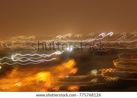 Abstract background of Long exposure vehicle light trails, night photography, noisy and blurred