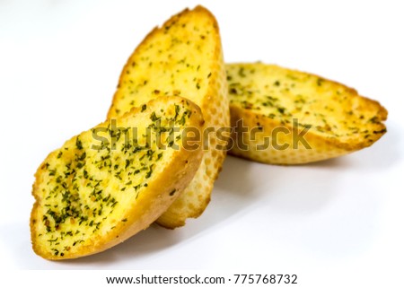 Three garlic bread slices ,isolated on white back ground.selective focus Royalty-Free Stock Photo #775768732