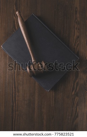 juridical book with hammer on wooden table, law concept