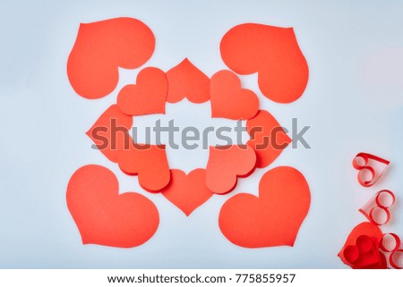 Valentine's Day theme with composition of red paper hearts for cards and backgrounds
