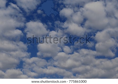 The sky is scattered with white clouds