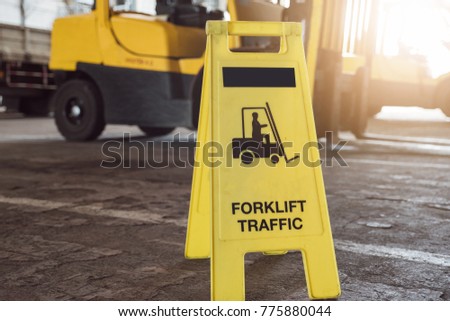 Sign showing warning of caution forklifts at industrial for safety.