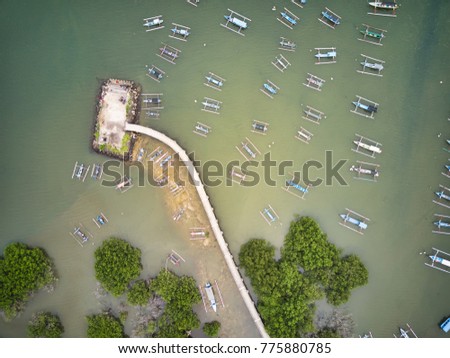 Aerial view serangan bay jetty with small jukung, small boat, cannoe, 