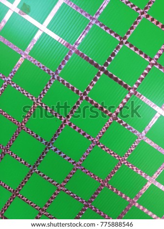 Grid purple on a green background.