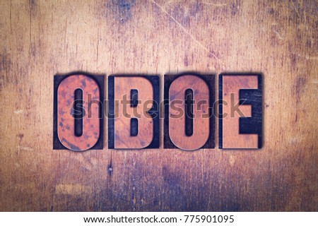 The word OBOE concept and theme written in vintage wooden letterpress type on a grunge background.