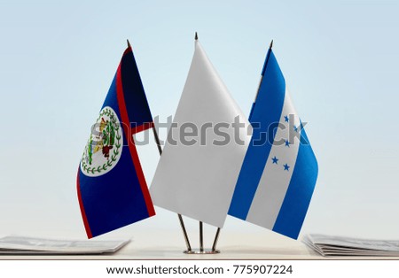 Flags of Belize and Honduras with a white flag in the middle