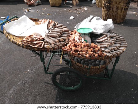 Dried fish on the threshing basket in the daytime.