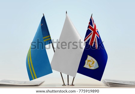 Flags of Aruba and Anguilla with a white flag in the middle