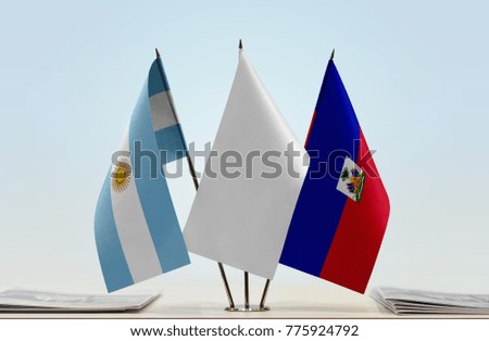 Flags of Argentina and Haiti with a white flag in the middle