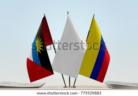 Flags of Antigua and Barbuda and Colombia with a white flag in the middle