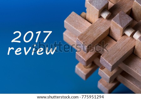 2017 Review, New year 2018 - Time to summarize and plan goals for the next year. Business background with wooden brain teaser