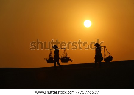 Silhouette people The red sand Mui Ne red sand hills in Binh Thuan, Vietnam