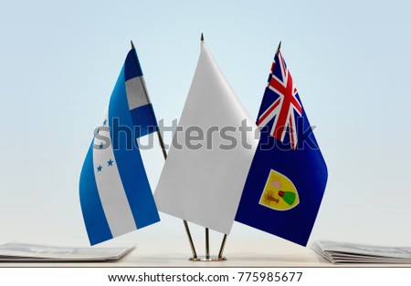 Flags of Honduras and Turks and Caicos Islands with a white flag in the middle