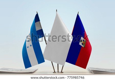 Flags of Honduras and Haiti with a white flag in the middle